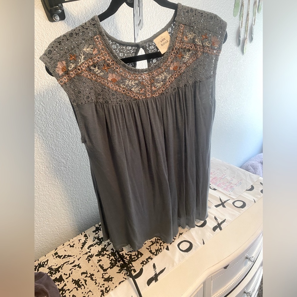 Lightly worn blouse. The top is a lace material and it fits a little big